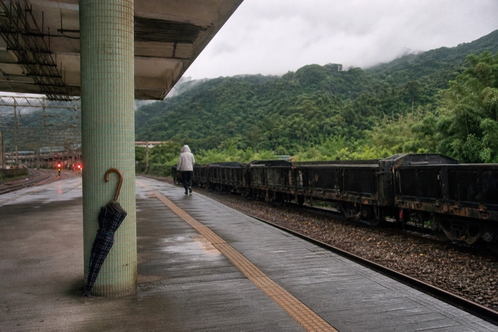 A train platform beside a rural station in the hills of northern Taiwan